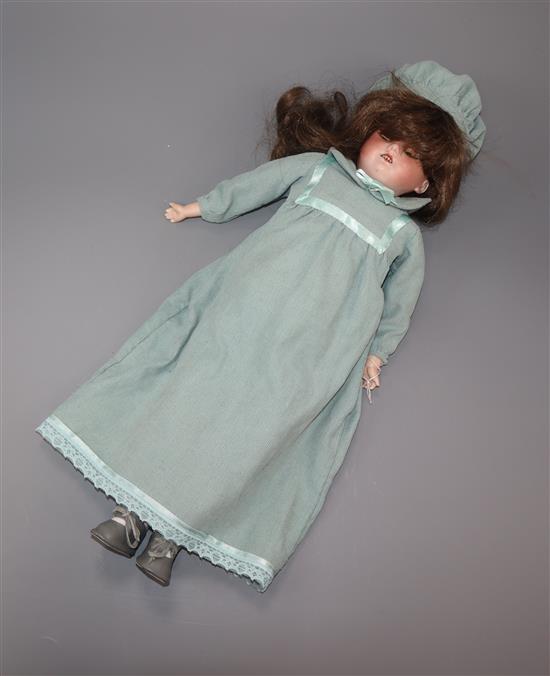 A German Armand Marseille bisque head and shoulder doll with sleeping eyes and jointed body. height 39cm